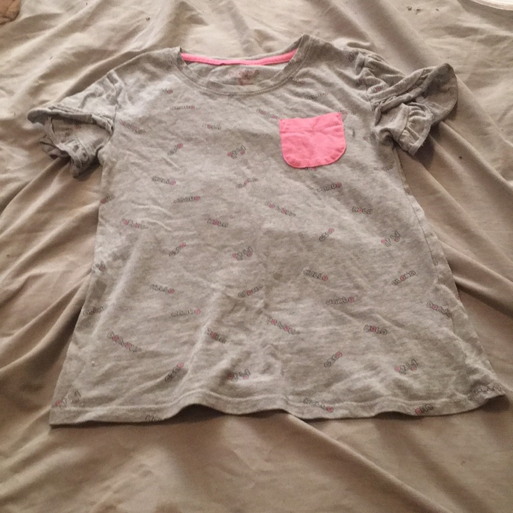 A gray and pink pocket shirt